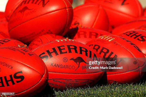 Sherrin footballs are placed to be collected by Kangaroos players during a North Melbourne Kangaroos training session at the Arden Street Ground on...