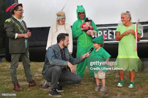 Event MC Kurt Long interacts with kids at the Street Food Cinema Presents 65th Anniversary Screening Of Disney's "Peter Pan" at Griffith Park on June...