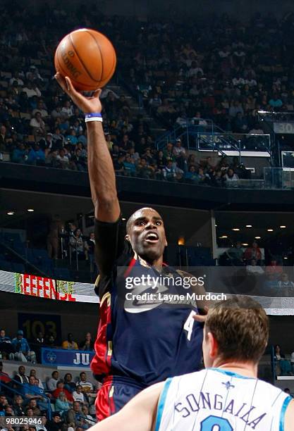 Antawn Jamison of the Cleveland Cavaliers shoots over Darius Songaila of the New Orleans Hornets on March 24, 2010 at the New Orleans Arena in New...
