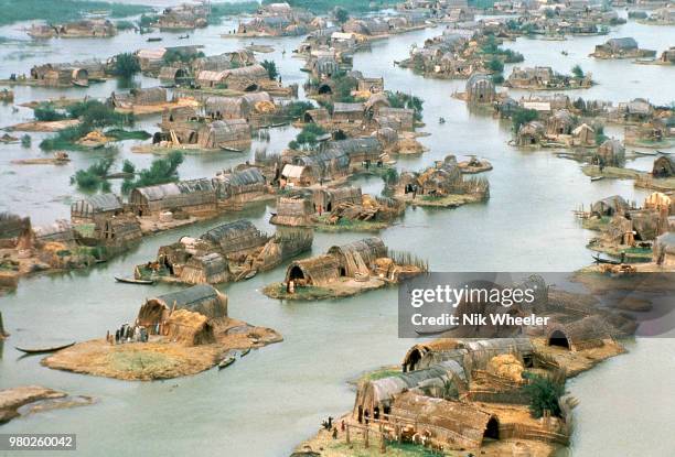 View of a traditional Marsh Arab village of reed houses in the wetlands of Southern Iraq circa 1978.