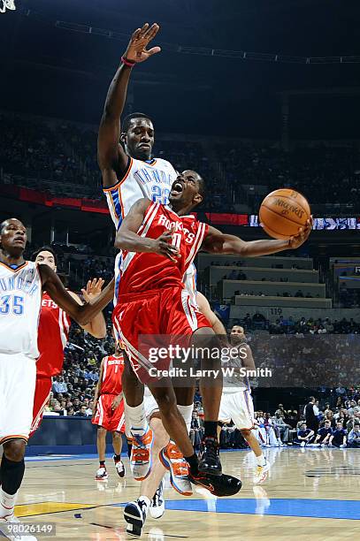 Aaron Brooks of the Houston Rockets goes to the basket against Jeff Green of the Oklahoma City Thunder during the game at the Ford Center on March...