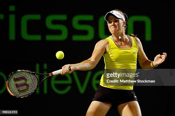 Melanie Oudin of the United States returns a shot against Michaella Krajicek of the Netherlands during day two of the 2010 Sony Ericsson Open at...