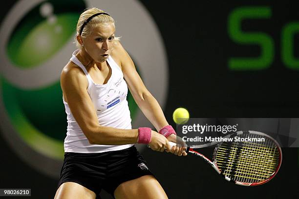 Michaella Krajicek of the Netherlands returns a shot against Melanie Oudin of the United States during day two of the 2010 Sony Ericsson Open at...