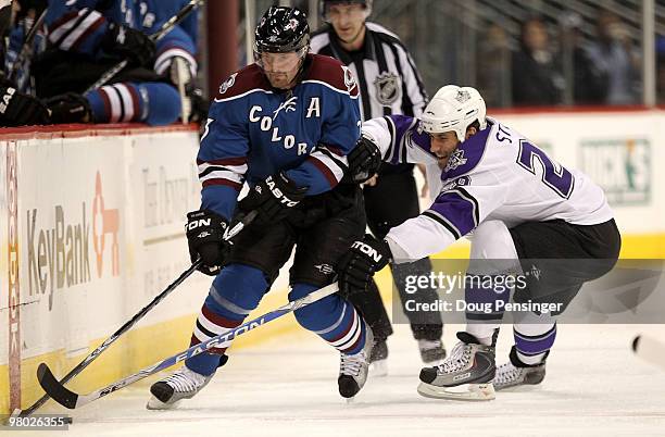 Milan Hejduk of the Colorado Avalanche tries to control the puck while under pressure from Jarrett Stoll of the Los Angeles Kings during NHL action...