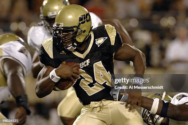 University of Central Florida tailback Kevin Smith rushes upfield against Pittsburgh on October 13, 2006 in Orlando, Florida. Pitt led at half time...