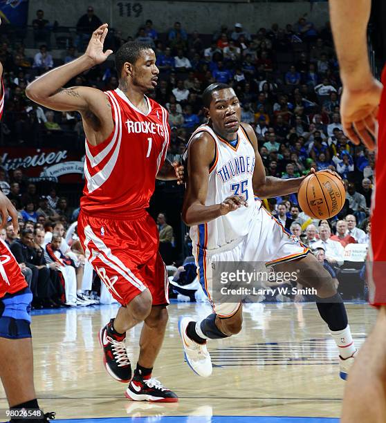 Kevin Durant of the Oklahoma City Thunder drives to the basket against Trevor Ariza of the Houston Rockets during the game at the Ford Center on...