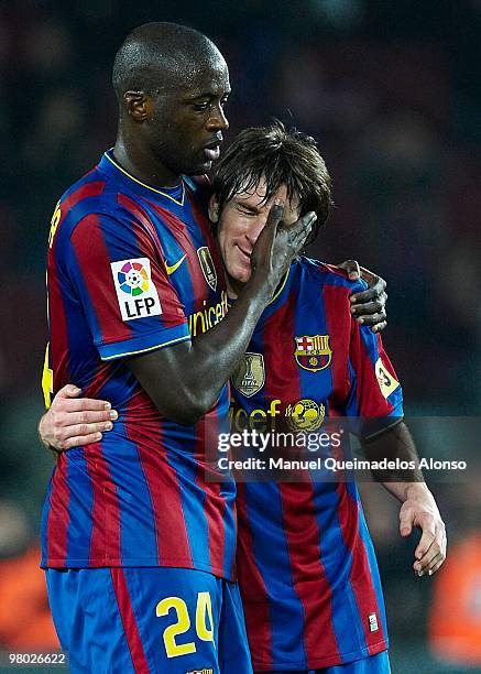 Toure Yaya of FC Barcelona embrances Lionel Messi at the end of the match after the La Liga match between Barcelona and Osasuna at the Camp Nou...