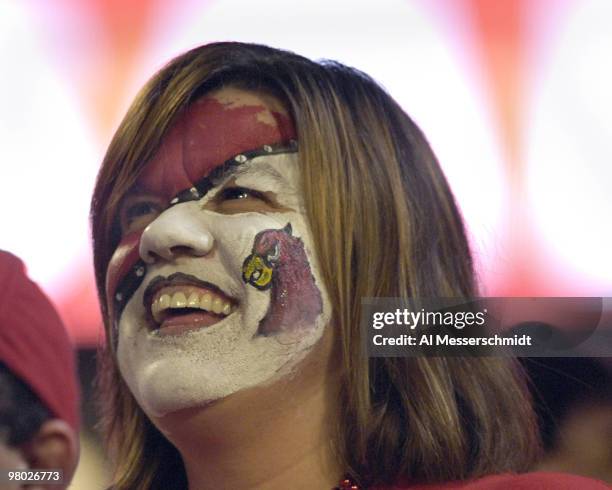 Loyal Louisville Cardinals fan displays team colors during the 73rd annual FedEx Orange Bowl between Louisville and Wake Forest at Dolphin Stadium in...