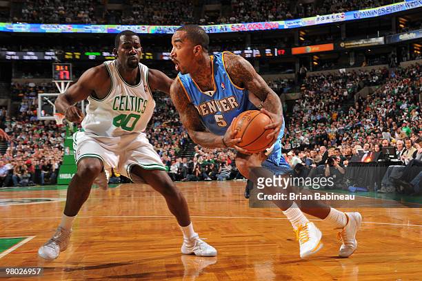 Smith of the Denver Nuggets drives to the basket against Michael Finley of the Boston Celtics on March 24, 2010 at the TD Garden in Boston,...
