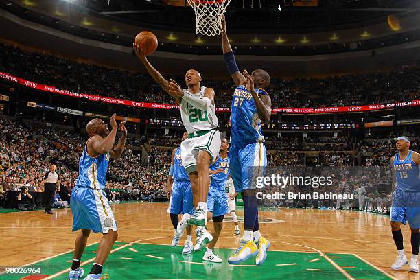 Ray Allen of the Boston Celtics lays the ball up in the lane against Johan Petro of the Denver Nuggets on March 24, 2010 at the TD Garden in Boston,...