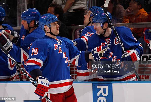 Marian Gaborik of the New York Rangers celebrates his goal with captain Chris Drury in the third period against the New York Islanders on March 24,...