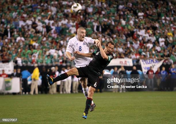 Gudmundur Krist Jansson of Iceland battles for the ball with Gerardo Torrado of Mexico during an international friendly at Bank of America Stadium on...