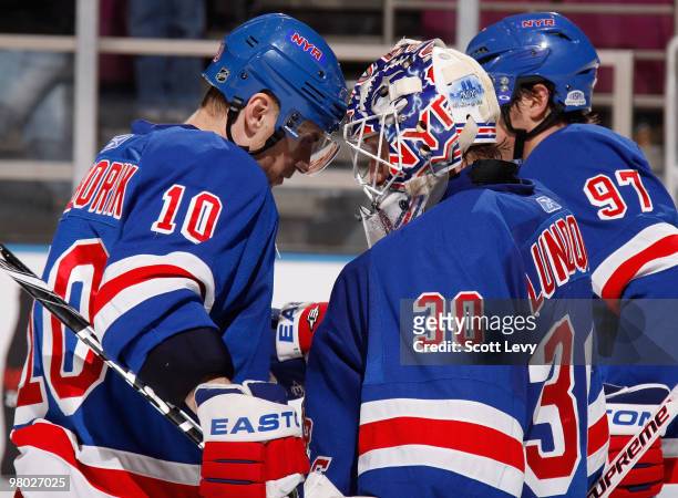 Marian Gaborik of the New York Rangers and number one star of the game congratulates goaltender Henrik Lundqvist on his shutout against the New York...