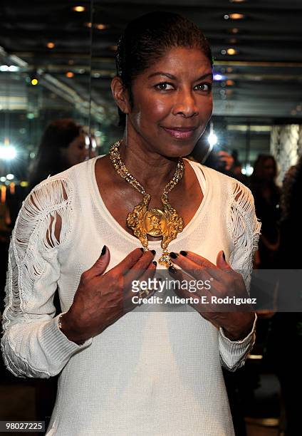 Singer Natalie Cole tries on jewelry at 'A Parisian Afternoon' hosted by The House of Lloyd Klein Couture on March 24, 2010 in Los Angeles,...