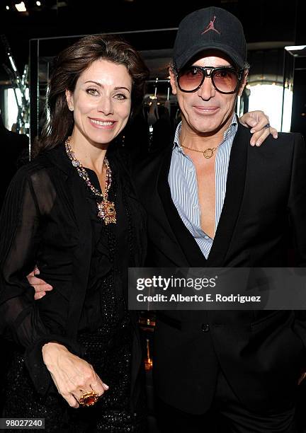 Jewelry designer Angela Tassoni-Newley and fashion designer Lloyd Klein pose at 'A Parisian Afternoon' hosted by The House of Lloyd Klein Couture on...