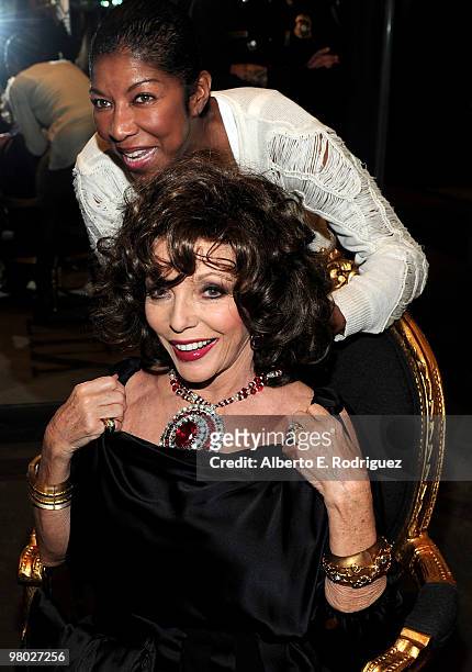 Singer Natalie Cole and actress Joan Collins try on jewelry at 'A Parisian Afternoon' hosted by The House of Lloyd Klein Couture on March 24, 2010 in...
