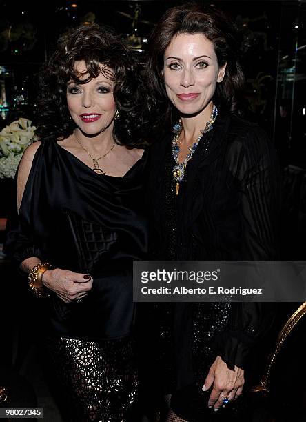 Actress Joan Collins and jewelry designer Angela Tassoni-Newley pose at 'A Parisian Afternoon' hosted by The House of Lloyd Klein Couture on March...