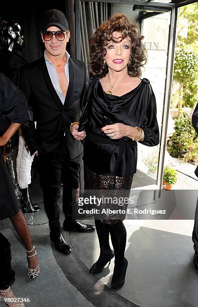 Designer Lloyd Klein and actress Joan Collins pose at 'A Parisian Afternoon' hosted by The House of Lloyd Klein Couture on March 24, 2010 in Los...