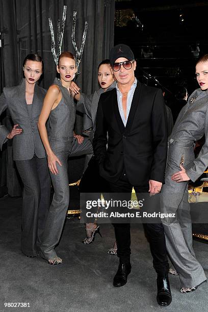 Fashion designer Lloyd Klein poses with models at 'A Parisian Afternoon' hosted by The House of Lloyd Klein Couture on March 24, 2010 in Los Angeles,...