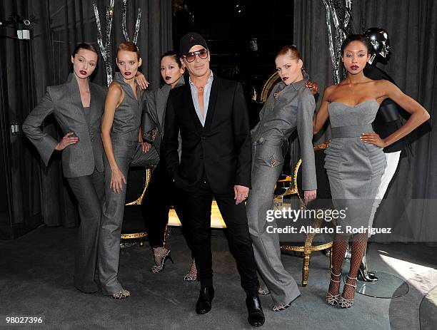 Fashion designer Lloyd Klein poses with models at 'A Parisian Afternoon' hosted by The House of Lloyd Klein Couture on March 24, 2010 in Los Angeles,...