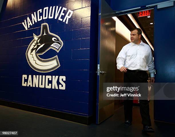 Head coach Alain Vigneault of the Vancouver Canucks leaves the dressing room after a team meeting prior to their game against the Anaheim Ducks at...
