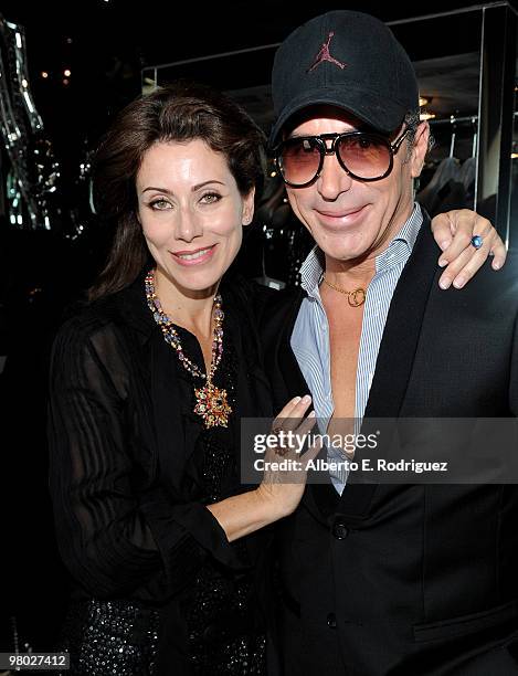 Jewelry designer Angela Tassoni-Newley and fashion designer Lloyd Klein pose at 'A Parisian Afternoon' hosted by The House of Lloyd Klein Couture on...