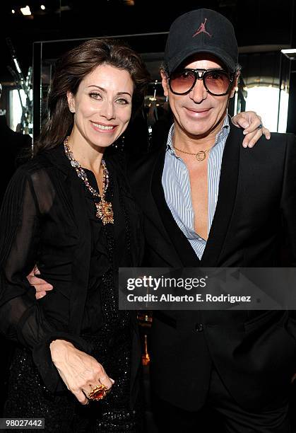 Jewelry designer Angela Tassoni-Newley and fashion designer Lloyd Klein pose at 'A Parisian Afternoon' hosted by The House of Lloyd Klein Couture on...