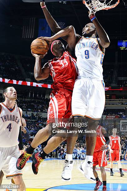 Mike Harris of the Houston Rockets goes to the basket against Serge Ibaka of the Oklahoma City Thunder during the game at the Ford Center on March...