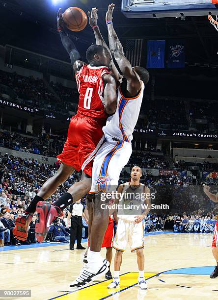 Jermaine Taylor of the Houston Rockets attempts to shoot the ball over Jeff Green of the Oklahoma City Thunder during the game at the Ford Center on...