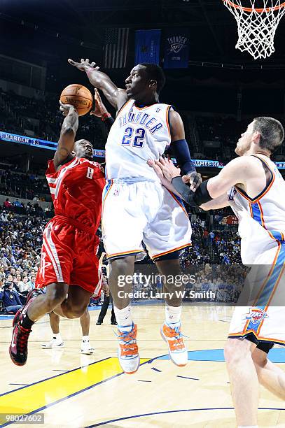 Jermaine Taylor of the Houston Rockets attempts to shoot the ball over Jeff Green of the Oklahoma City Thunder during the game at the Ford Center on...