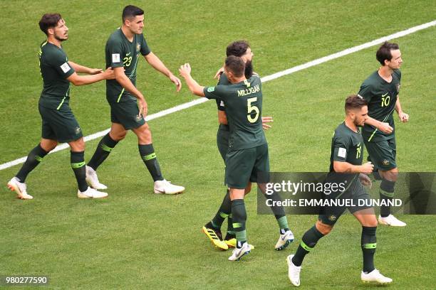 Australia's midfielder Mile Jedinak celebrates with teammates after scoring a penalty kick during the Russia 2018 World Cup Group C football match...
