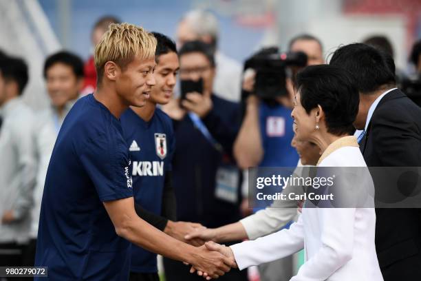 Keisuke Honda of Japan greets Hisako, Princess Takamado prior to the Japan Training Session on June 21, 2018 in Kazan, Russia.
