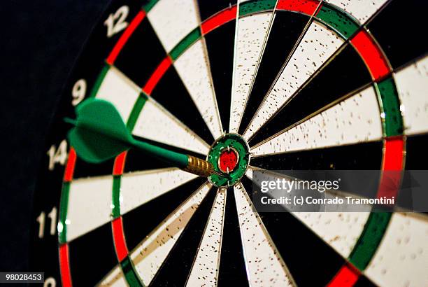 dart in target bull's-eye  - darttavla bildbanksfoton och bilder