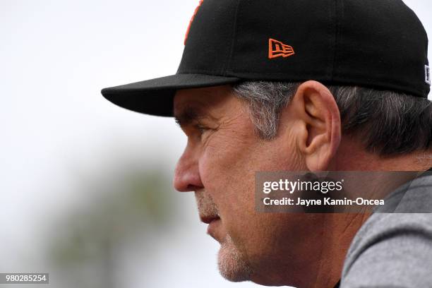 Bruce Bochy of the San Francisco Giants looks on from the dugout during the game against the Los Angeles Dodgers at Dodger Stadium on June 16, 2018...