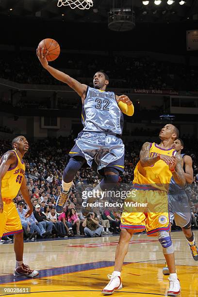 Mayo of the Memphis Grizzlies lays the ball up against Monta Ellis of the Golden State Warriors on March 24, 2010 at Oracle Arena in Oakland,...