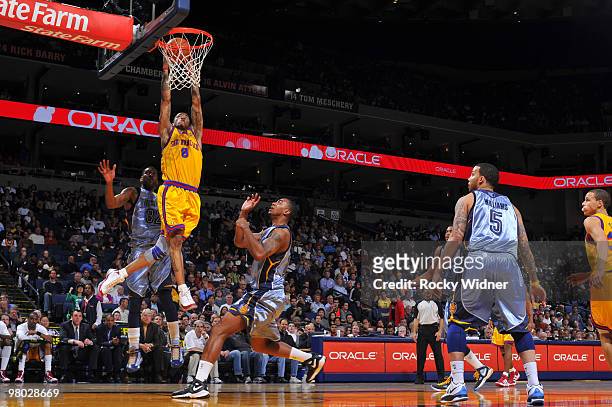 Monta Ellis of the Golden State Warriors dunks the ball against O.J. Mayo of the Memphis Grizzlies on March 24, 2010 at Oracle Arena in Oakland,...