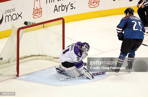 Chris Stewart of the Colorado Avalanche watches as his overtime shootout goal hit the back of the net against goaltender Erik Ersberg of the Los...