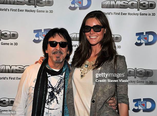 Peter Criss of KISS and model Hillary Rhoda attend the first hockey game in 3D telecast viewing party at Madison Square Garden on March 24, 2010 in...