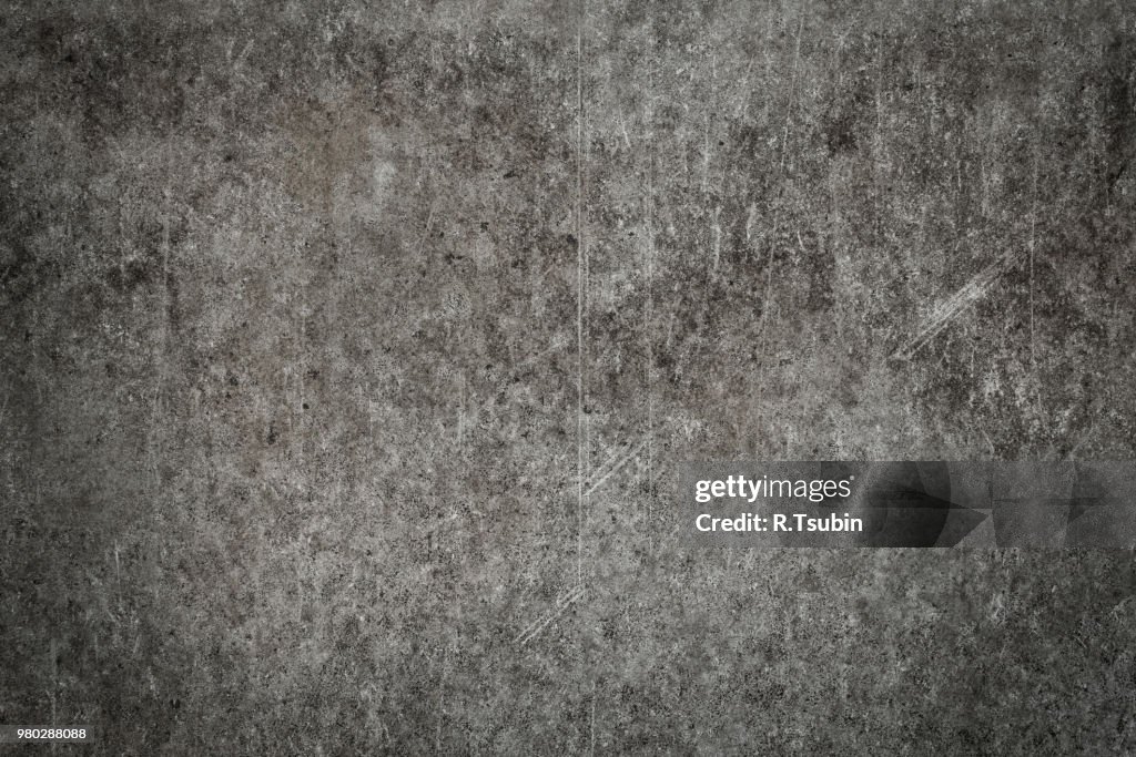 Old grungy scratched concrete wall as abstract background texture