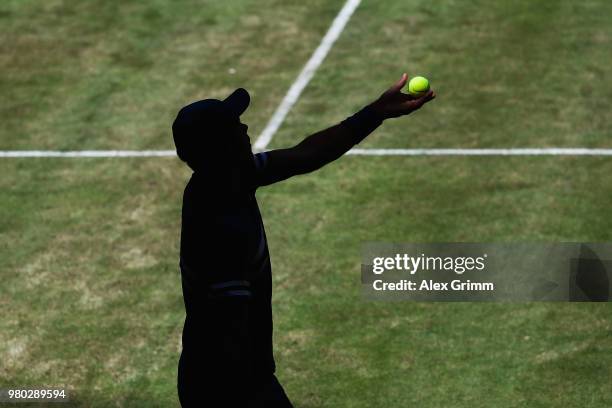 Borna Coric of Croatia serves the ball to Nikoloz Basilashvili of Georgia during their round of 16 match on during day 4 of the Gerry Weber Open at...