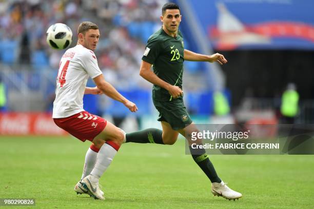 Australia's midfielder Tomas Rogic plays the ball past Denmark's defender Henrik Dalsgaard during the Russia 2018 World Cup Group C football match...