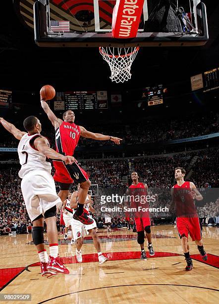 DeMar DeRozan of the Toronto Raptors elevates for a dunk against Brandon Roy of the Portland Trail Blazers during the game at The Rose Garden on...