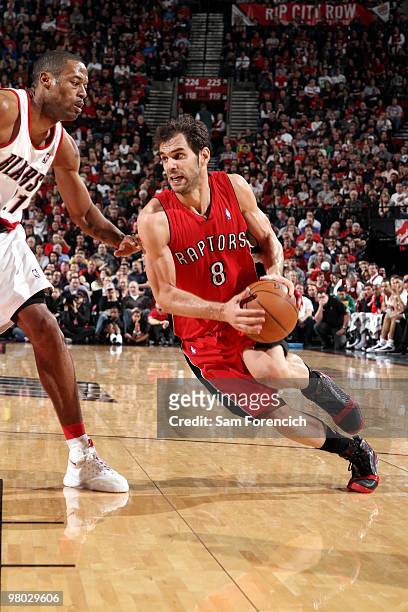 Jose Calderon of the Toronto Raptors drives to the basket against Marcus Camby of the Portland Trail Blazers during the game at The Rose Garden on...