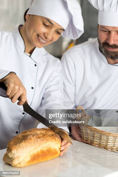 chefs with bread - bread knife stock pictures, royalty-free photos & images