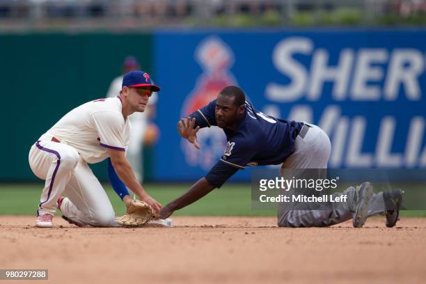Lorenzo Cain of the Milwaukee Brewers steals second base past Scott Kingery of the Philadelphia Phillies in the top of the fifth inning at Citizens...
