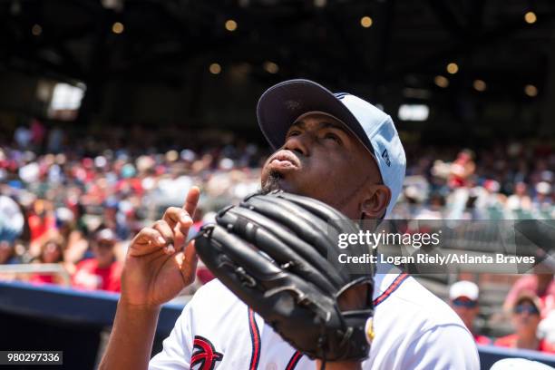 Julio Teheran of the Atlanta Braves points to the sky before leaving the dugout against the San Diego Padres at SunTrust Park on June 17 in Atlanta,...