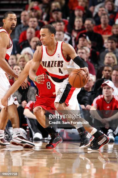 Jerryd Bayless of the Portland Trail Blazers drives the ball against Jose Calderon of the Toronto Raptors during the game at The Rose Garden on March...