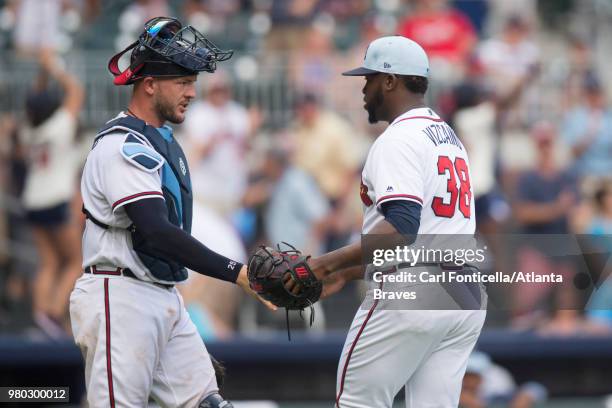 Tyler Flowers and Arodys Vizcaino of the Atlanta Braves celebrate the win against the San Diego Padres at SunTrust Park on June 17 in Atlanta,...