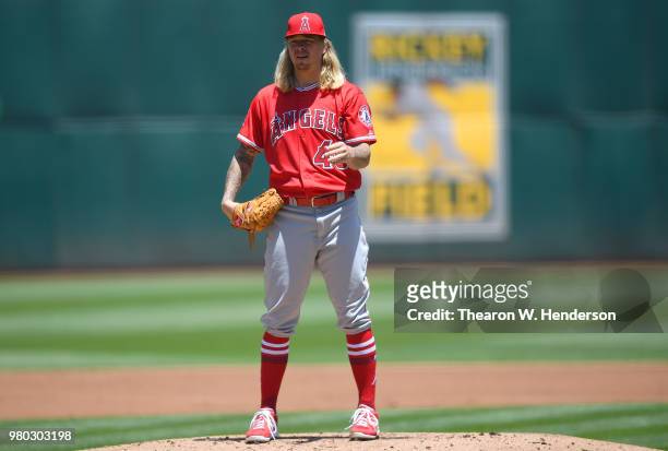 John Lamb of the Los Angeles Angels of Anaheim pitches against the Oakland Athletics in the bottom of the first inning at the Oakland Alameda...