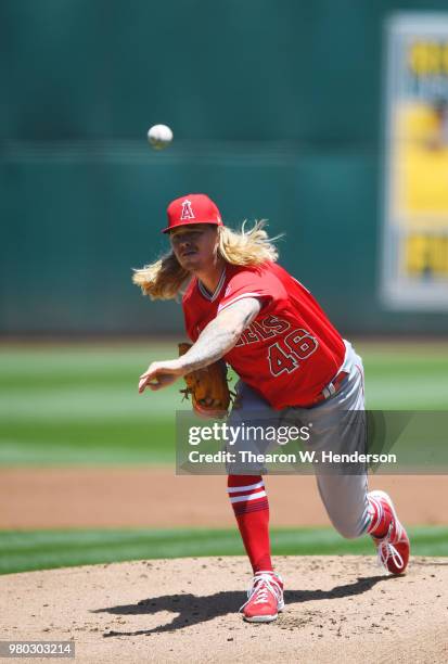 John Lamb of the Los Angeles Angels of Anaheim pitches against the Oakland Athletics in the bottom of the first inning at the Oakland Alameda...